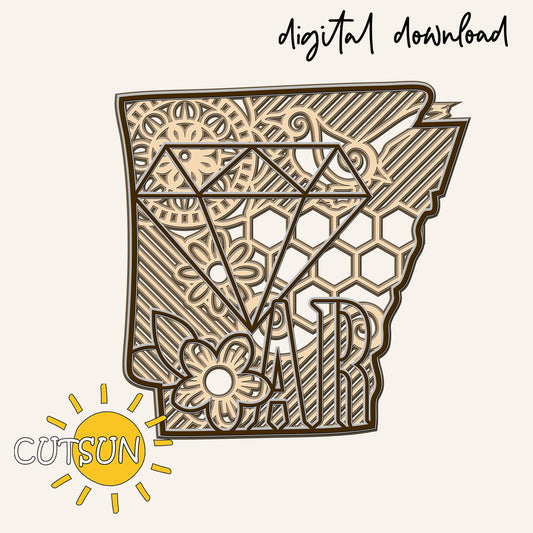 Decorative design in the shape of Arkansas state, with floral and mandala elements.