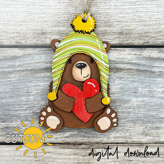 Layered bear with heart ornament SVG file for laser cutting, featuring a winter hat and red heart, perfect for Valentine’s crafts and gifts.
