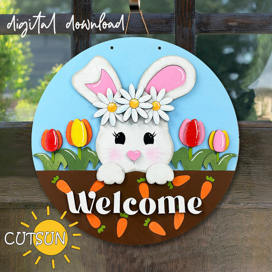 A digital image of a bunny with a daisy crown and carrots, alongside the word 'Welcome' written in a stylized font, designed for laser cutting and craft projects.