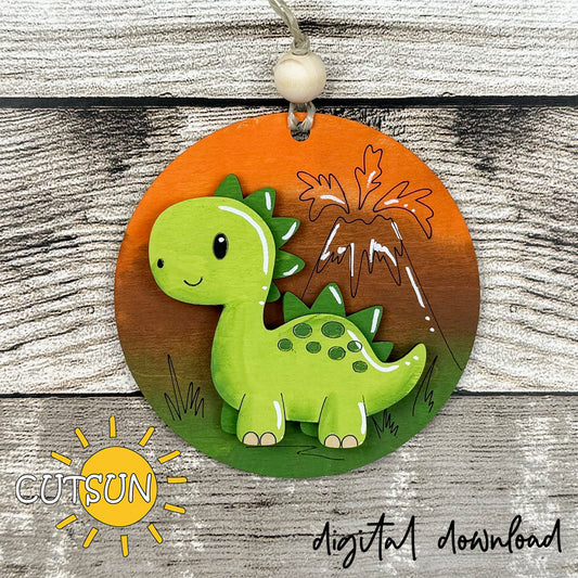 Layered dinosaur ornament SVG with green dino and volcano, laser cut file for wood or acrylic.