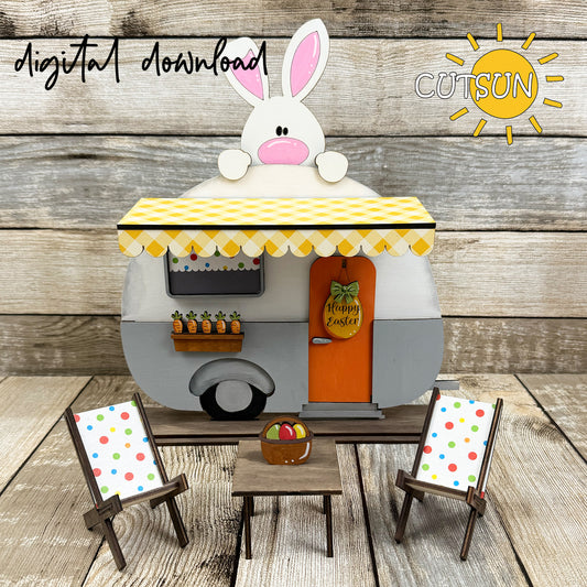 A digital representation of a Easter-themed camper decor set with a bunny, carrots, an egg-shaped door hanger, and Easter basket, meant to be laser cut or printed.