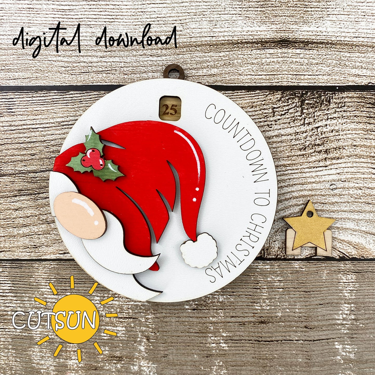 Digital download for a Christmas countdown ornamentfeaturing a cute gnome peeking from the side, wearing a Santa hat with a holly berry.