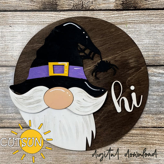 Round door hanger with a cut-out gnome design, featuring a witch hat, spider, and spider web, with the text 'HI' on the right side. The background is a wooden texture, and there is a logo 'CUTSUN' in the corner.