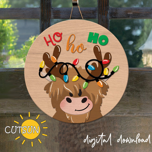 Digital download for a Christmas door hanger featuring a highland cow with Christmas lights around its head.