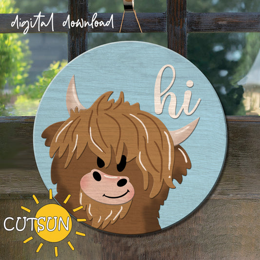 A digital illustration of a cartoon highland cow with a sun and rainbow background, indicating a cheerful and sunny design, used for a door hanger or sign.
