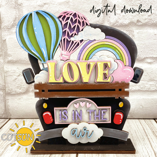 A digital rendering of a hot air balloon add-on for a truck SVG laser cut file, with the words 'LOVE IS IN THE AIR' displayed.