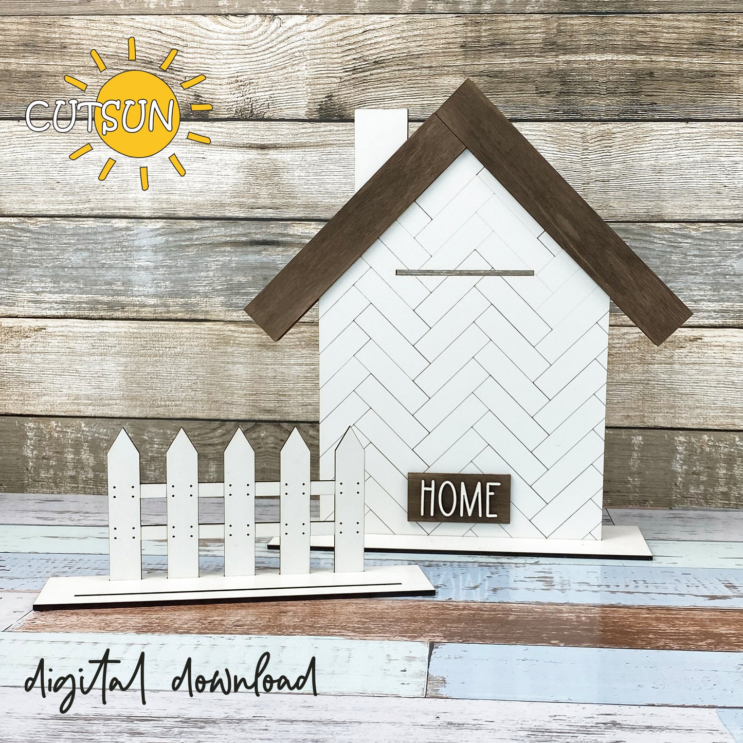 A digital download of a laser cut shelf decor featuring a white house with a brown roof, a black fence, and a 'HOME' sign. The decor is set against a wooden background.