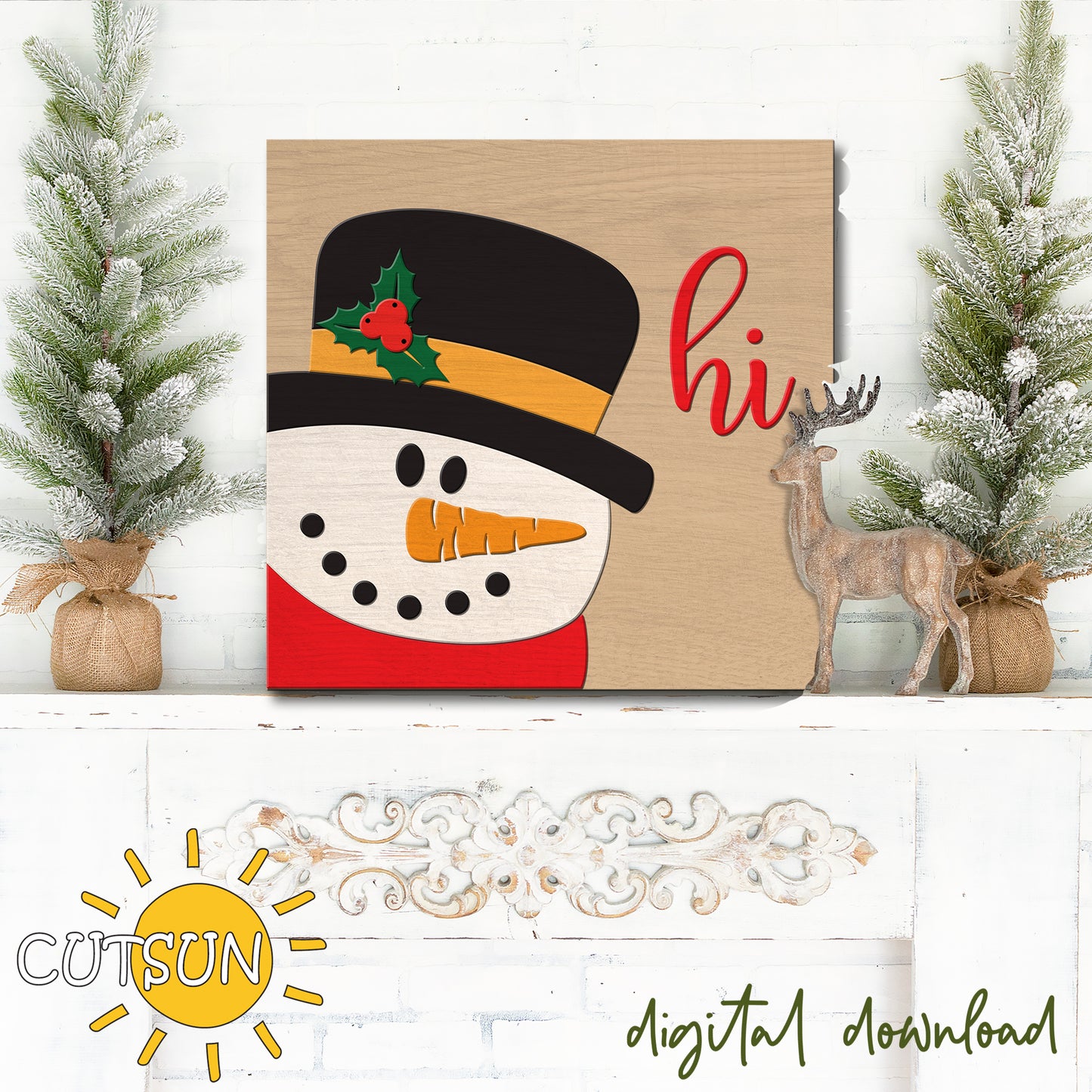 Decorative sign with a snowman design and 'hi' text, surrounded by Christmas decor on a white wooden surface.
