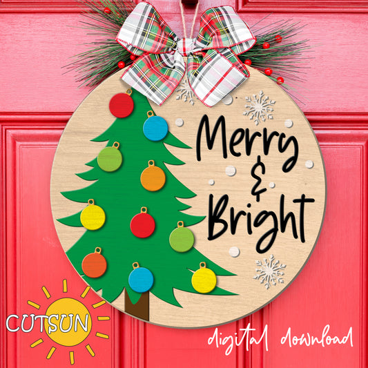 Decorative Christmas ornament with a tree and colorful ornaments on a pink background, featuring the brand 'CUTSUN'.