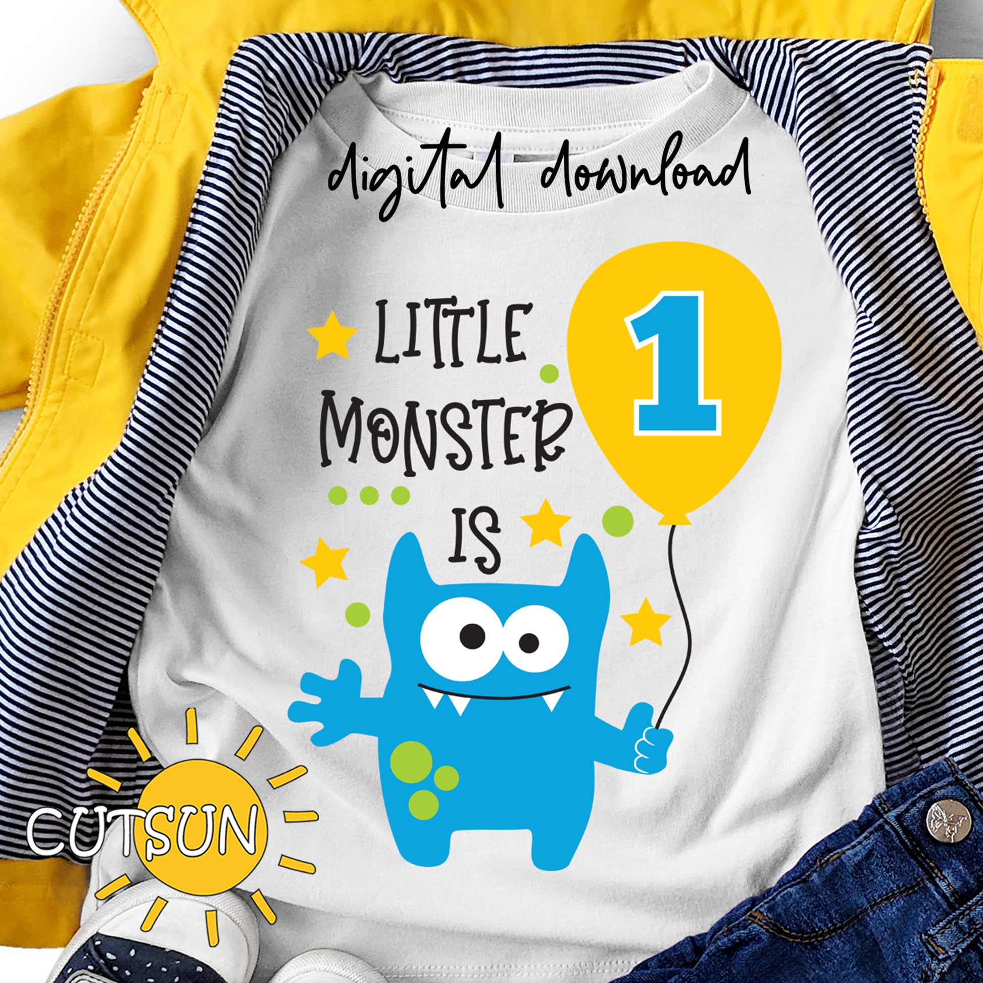 Children's shirt with blue monster design and text 'Little Monster is 1' on a white background.