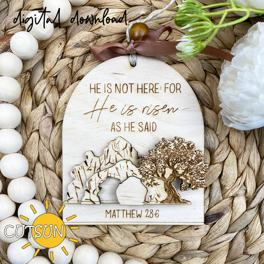 Decorative wooden plaque with religious text and scenery on a woven surface.