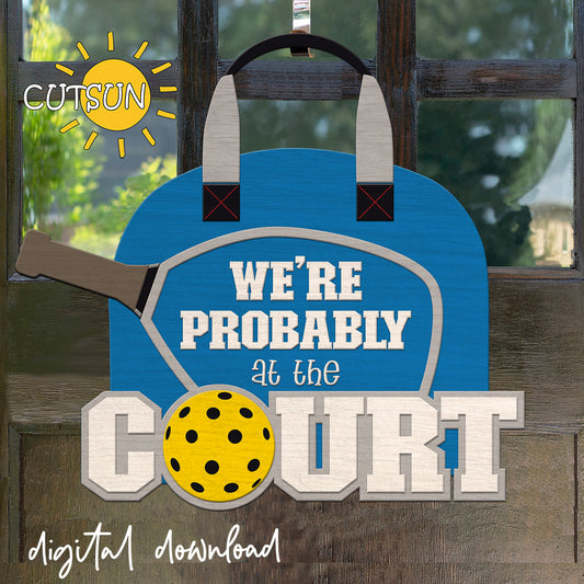 Decorative sign with text 'We're Probably at the Court' featuring a paddle and ball, with Cutsun logo.