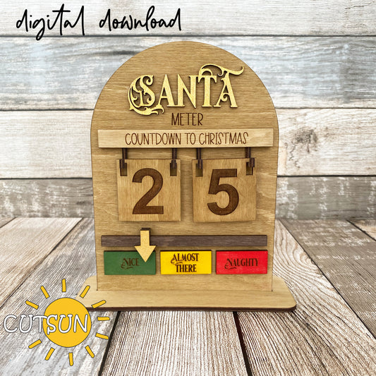 A wooden shelf sitter with a digital download label, featuring a countdown to Christmas meter with numbers from 25 to 0, and three color-coded areas labeled 'Naughty', 'Almost There', and 'Nice'.