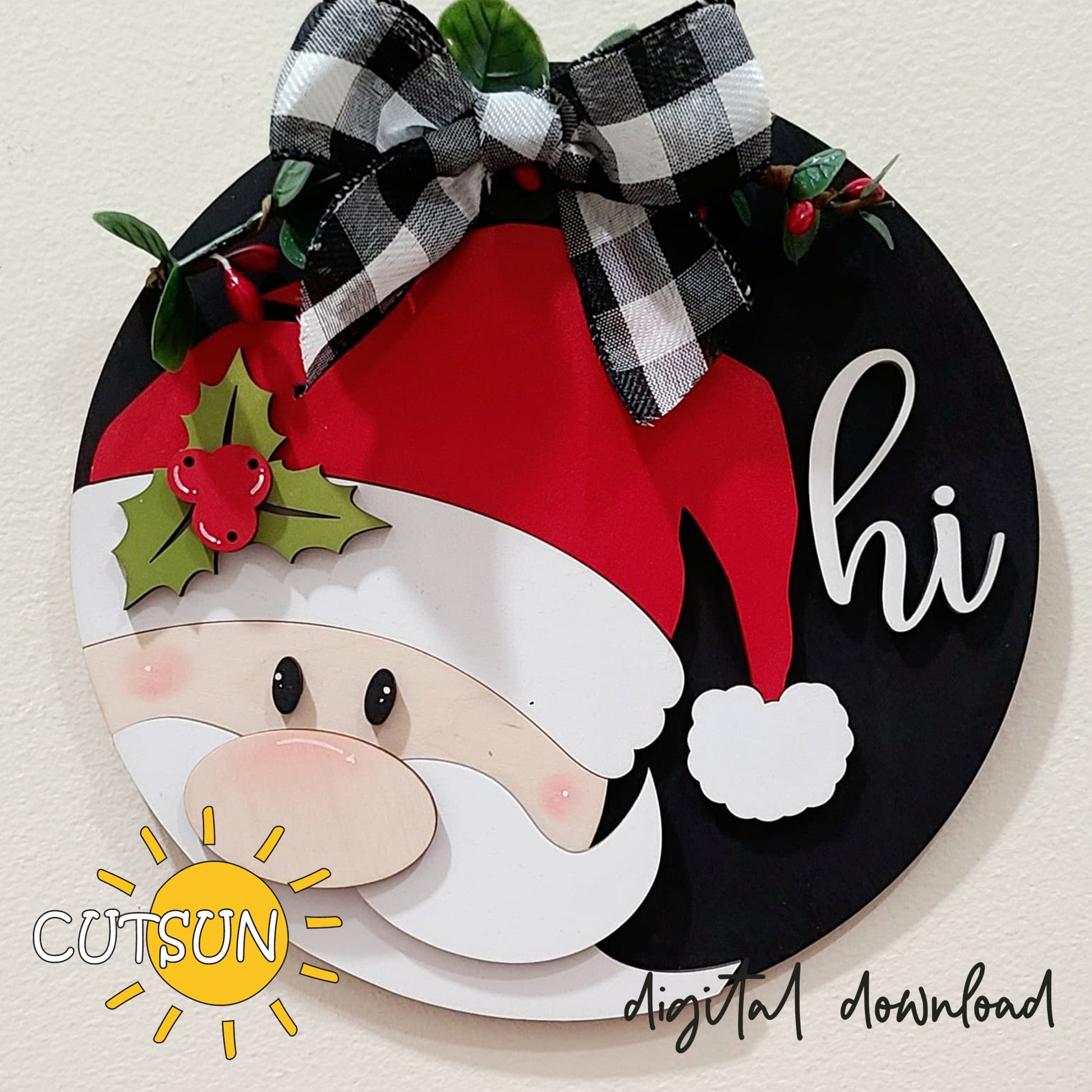 Round Christmas door hanger with a Santa Claus design, red and white color scheme, with the text 'Hi' and a sun motif.