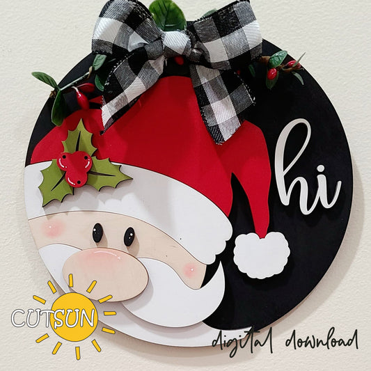 Round Christmas door hanger with a Santa Claus design, red and white color scheme, with the text 'Hi' and a sun motif.