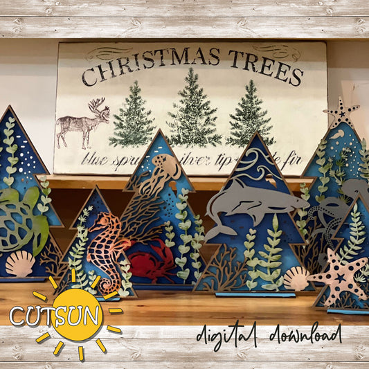 A set of digitally designed Christmas trees with sea life themes, including patterns such as corals, sea grass, and shells, displayed in a series of three sizes.
