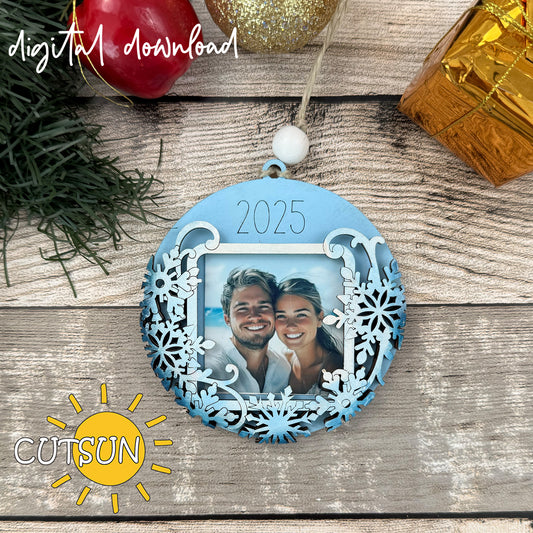 Laser cut snowflake photo ornament with “2025” engraving and square photo opening. Digital SVG file for Glowforge and laser cutting.