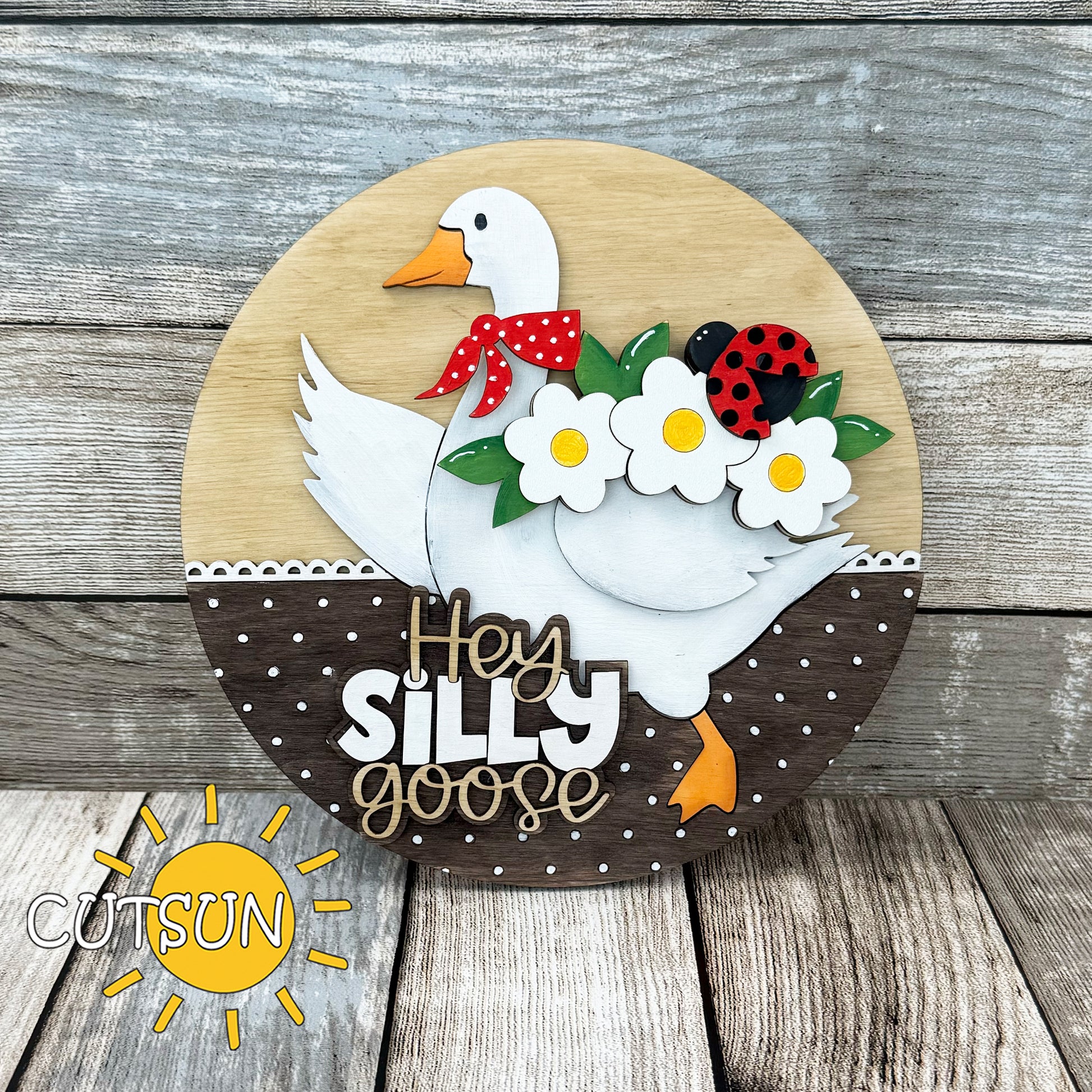 Laser cut spring add-on for interchangeable goose door hanger featuring daisies, ladybug, and scarf