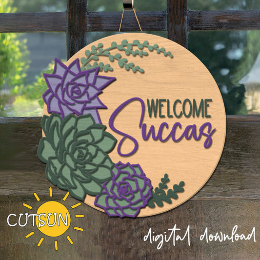 Decorative sign with succulents and 'Welcome Succas' text on a wooden background, featuring the CUTSUN brand.