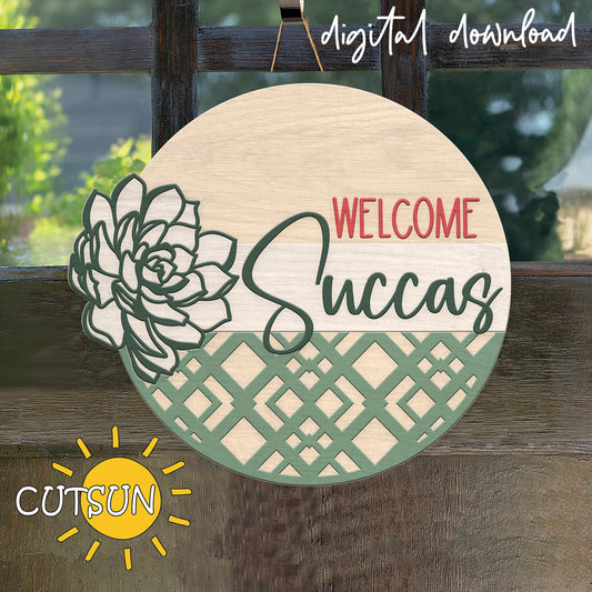 Decorative round sign with succulent design and 'Welcome Succas' text on a wooden background, featuring the CutSun brand.