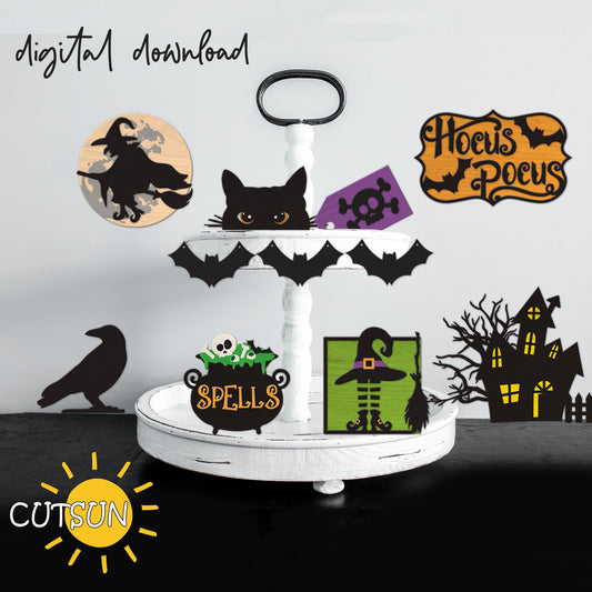 A digital download of a tiered tray with various Halloween-themed cut-outs including a black cat, witch's legs, a haunted house, and bats, among others.