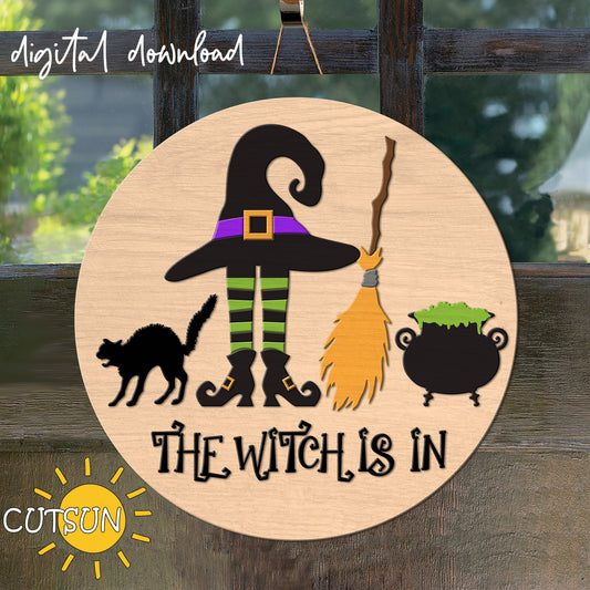 A digital door hanger featuring a witch's hat and legs, a black cat, a broom, a cauldron, and the text 'THE WITCH IS IN!'