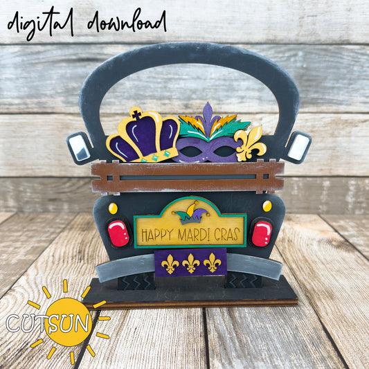 A digital download image showing a decorative truck with a 'Happy Mardi Gras' sign, featuring a crown, face mask, and fleur-de-lis design.