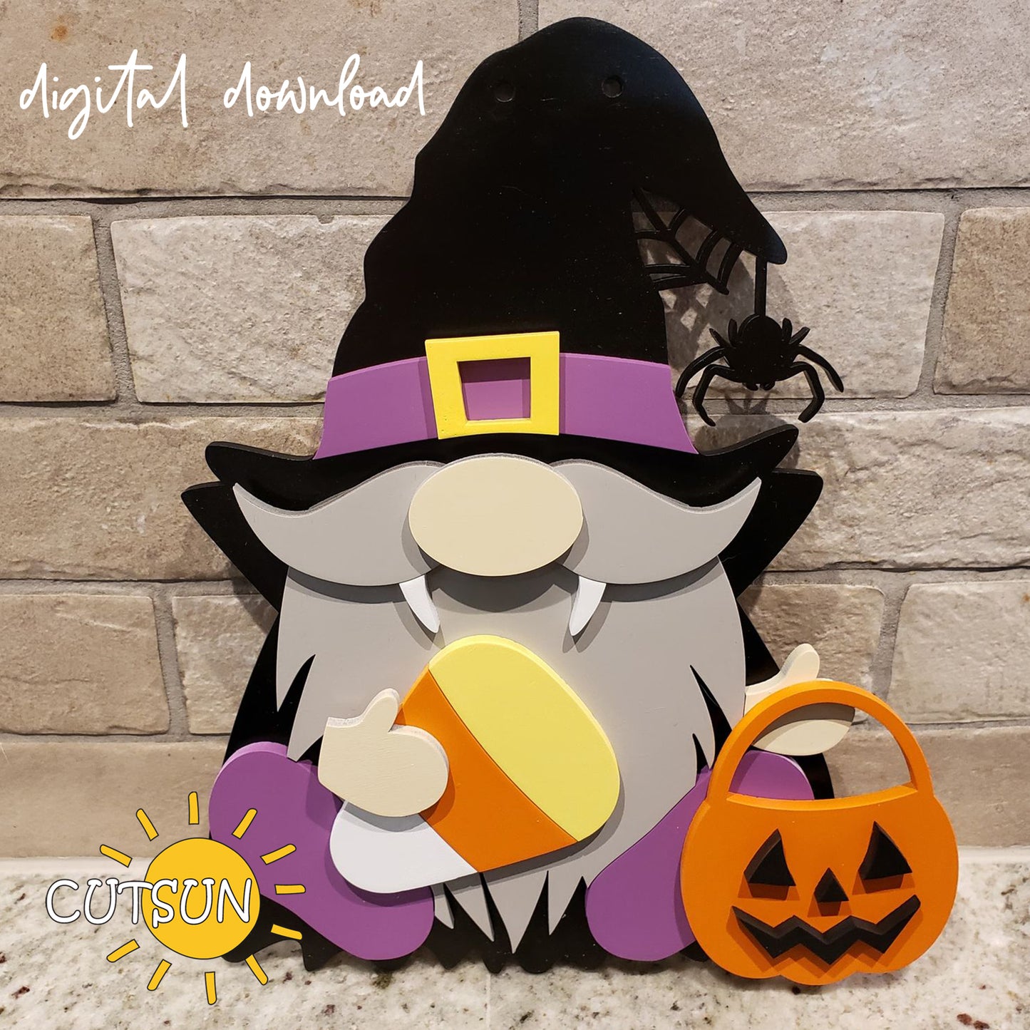 A digital download of a Halloween-themed gnome door hanger, featuring a vampire gnome with a candy corn and a Jack O'lantern. The gnome is dressed in a black and purple costume with a black hat, holding a pumpkin, and there is a spider on the web in the background.