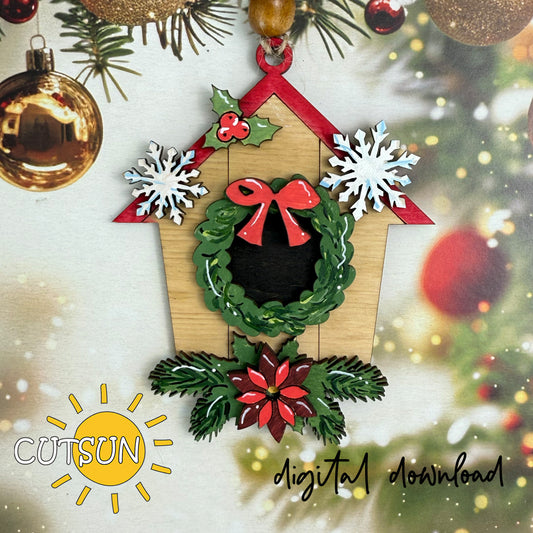 Decorative Christmas ornament with a wreath and bow on a blurred festive background