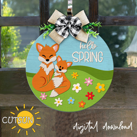 Digital download for a door hanger featuring two cute foxes, green meadows and spring flowers.