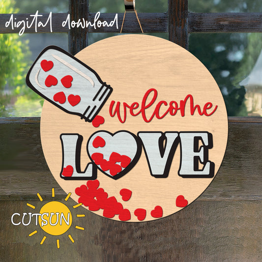 Decorative sign with 'welcome love' text and heart designs on a wooden background.