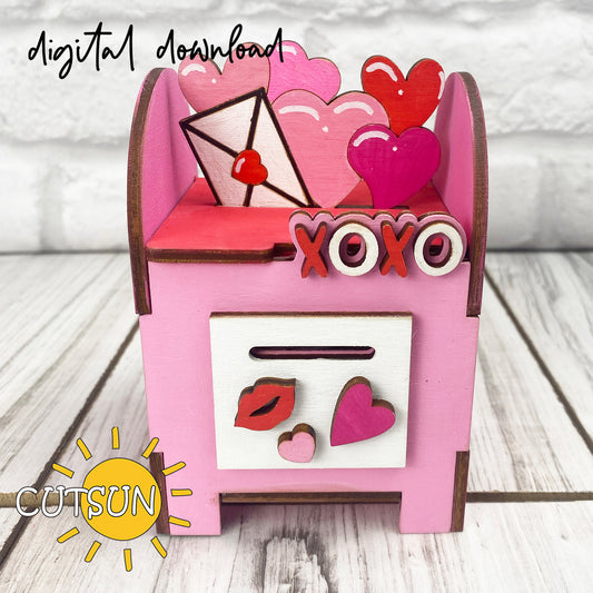 Pink mailbox with heart designs and 'XOYO' text on a wooden surface, featuring the CUTSUN logo.