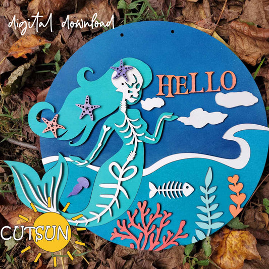 A digital download image featuring a circular door sign with a mermaid skeleton design, the text 'Hello', and various sea life motifs such as fish and coral.
