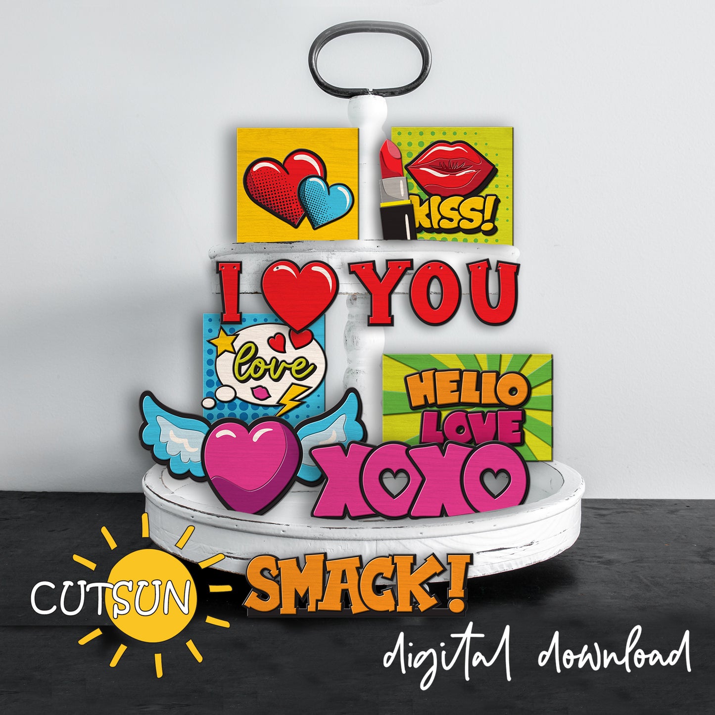 Decorative stand with colorful signs featuring love-themed designs on a gray background.