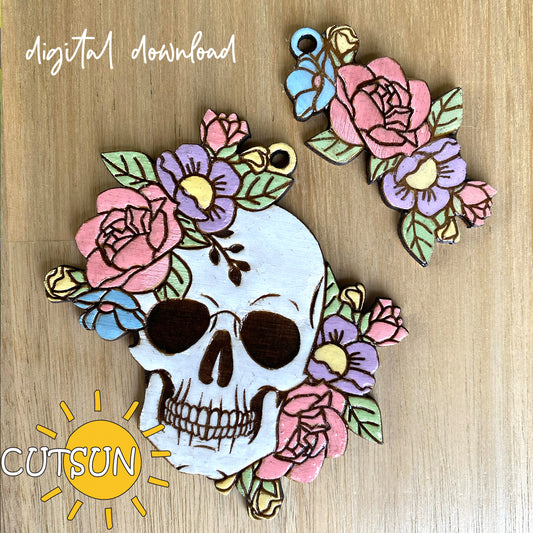 A digital download of a floral skull charm, depicted as a skull with colorful flowers on it, arranged on a wooden surface with a 'Cutsun' logo and 'Digital Download' text.