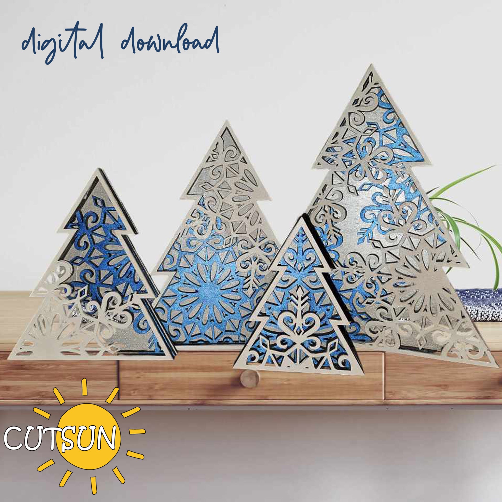 A set of four blue and white standing Christmas trees laser cut file, displayed in different sizes, with the brand CutsunSVG visible in the image.
