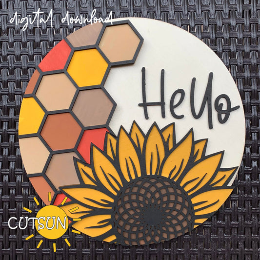 A digital download image showing a round sign with a sunflower and honeycomb pattern and the word 'Hello!' in bold letters.