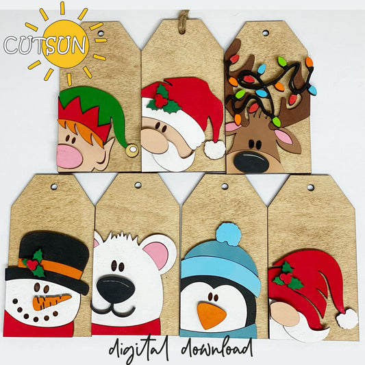 A set of digitally downloadable Christmas-themed gift tags with cute animal illustrations including a reindeer, polar bear, elf, and penguin, among others.