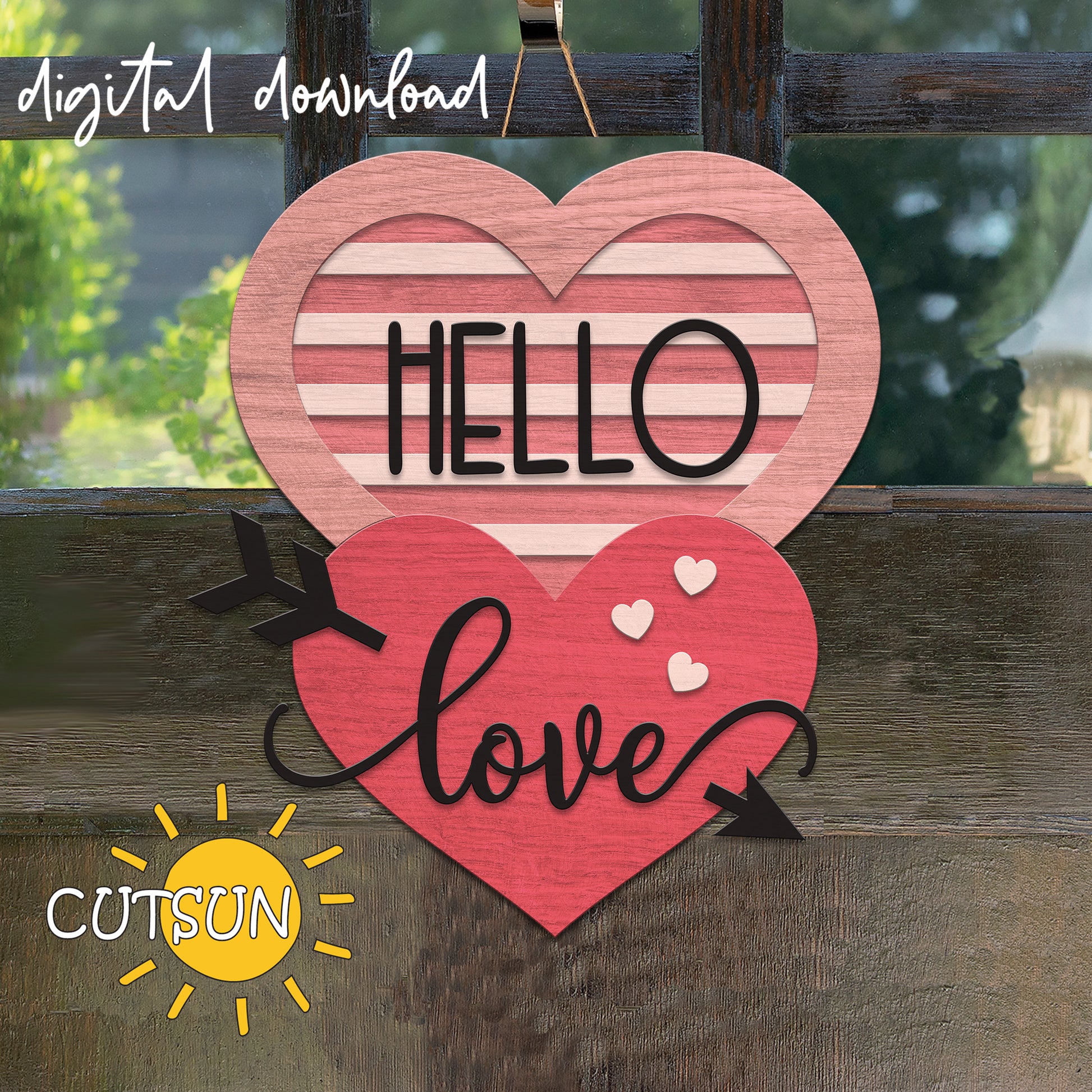 Heart-shaped wooden cutout with 'HELLO' and 'love' text on a wooden background, featuring the CUTSUN brand.