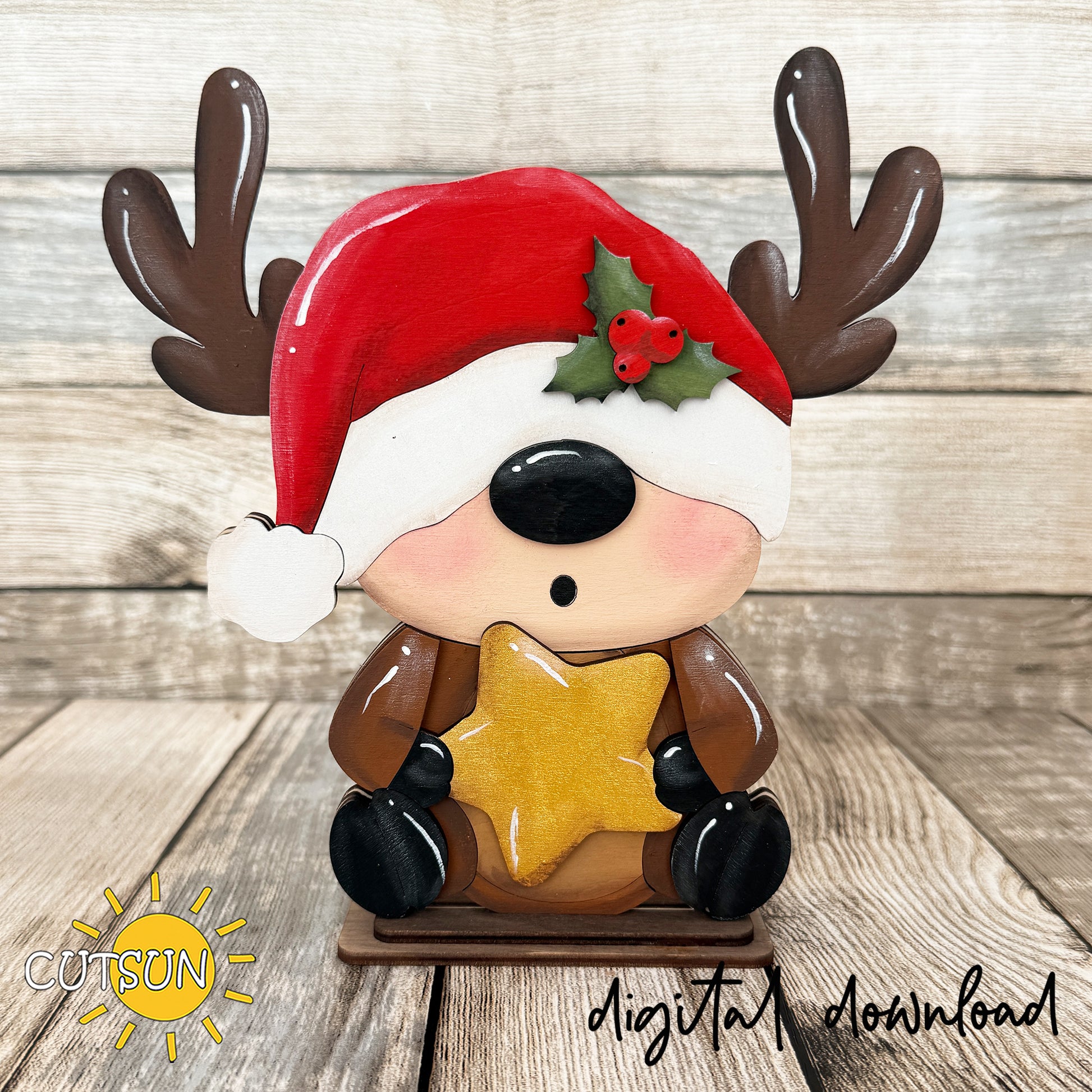 A festive ceramic Christmas reindeer figurine with brown antlers, a red Santa hat, and a yellow star, displayed on a rustic wood background. Watermarks for 'COTSON' and 'digital download' are visible.