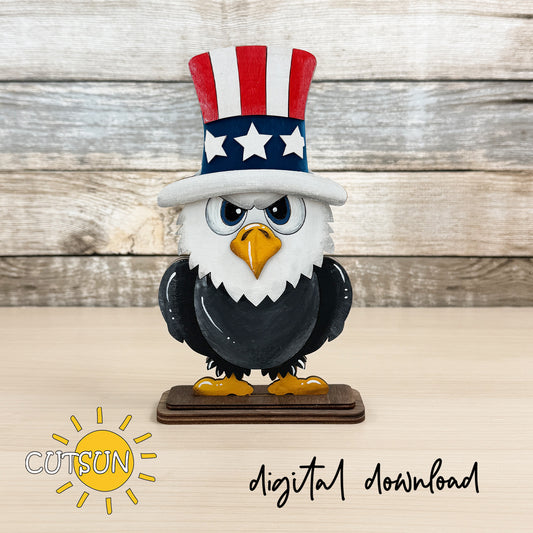 Layered wooden bald eagle shelf sitter with Uncle Sam hat and patriotic stars on a stand, designed for laser cut decor