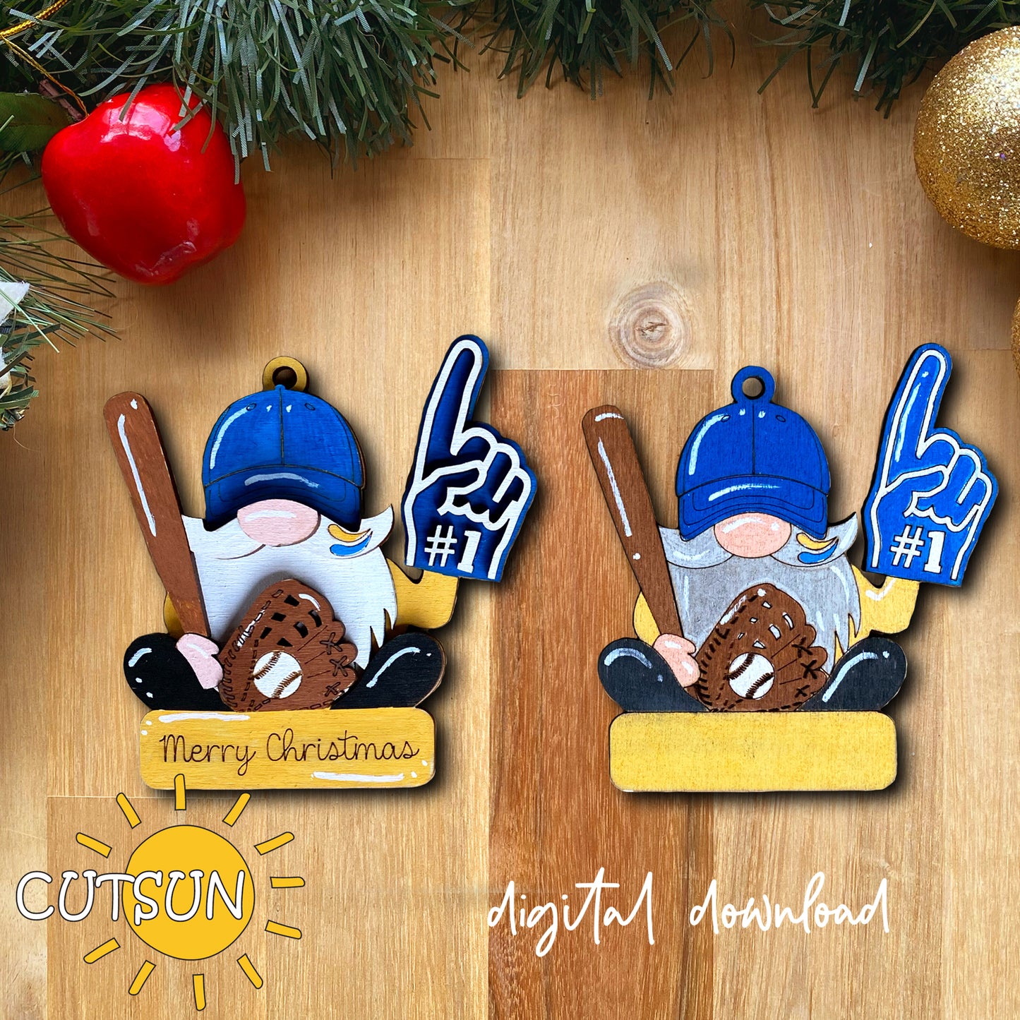 Two Christmas gnome ornaments with blue hats and baseball bats on a wooden surface, featuring the brand 'CUTSUN'.