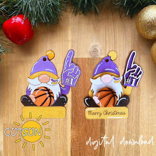Two Christmas gnome ornaments with basketballs on a wooden surface with holiday decorations.