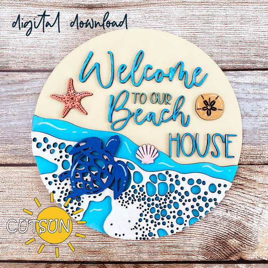 Round beach-themed welcome sign with layered turtle, starfish, sand dollar, seashells, and “Welcome to Our Beach House” text.