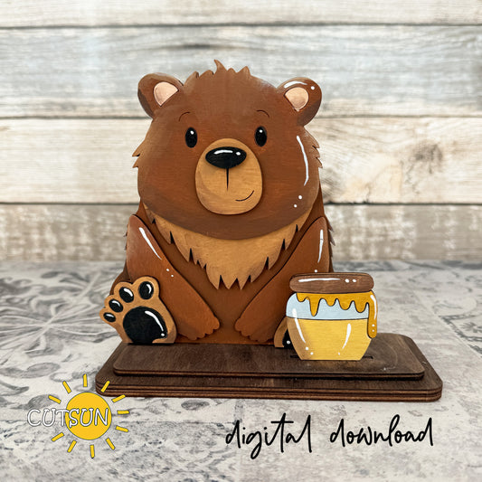 Layered wooden bear shelf sitter with a honey jar add-on, designed as interchangeable laser cut decor with a cute woodland theme
