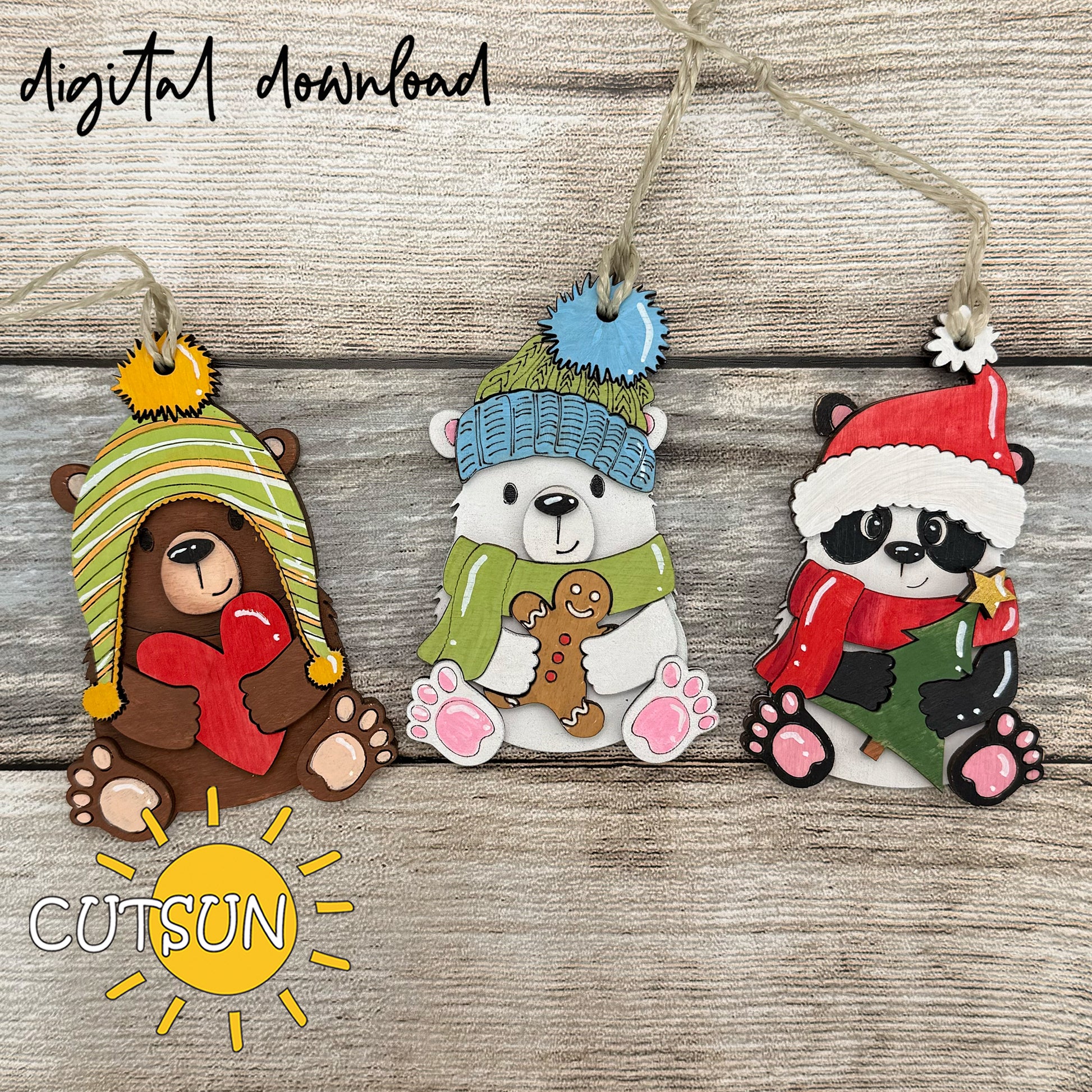 Three Christmas-themed animal ornaments with colorful hats and scarves on a wooden background, featuring the brand 'CUTSUN'.
