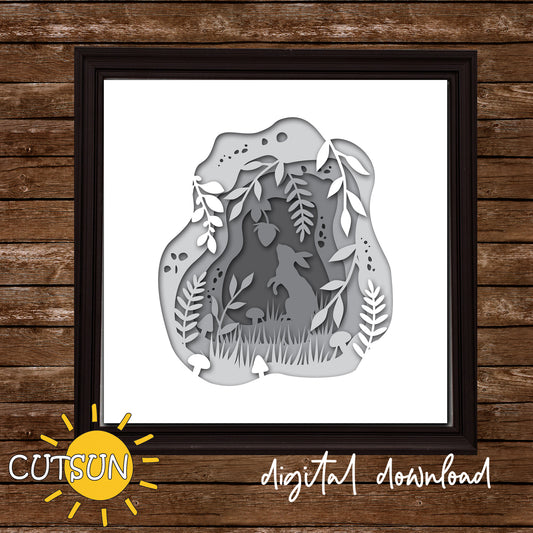 Framed paper cut art of a rabbit in a forest design on a wooden background with 'CUTSUN' branding.