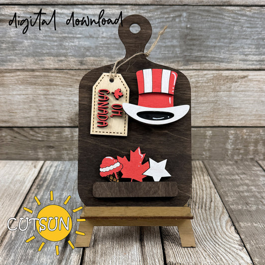 Interchangeable Canada cutting board decor SVG with Oh Canada tag, maple leaf, stars, and patriotic hat, layered laser cut file.