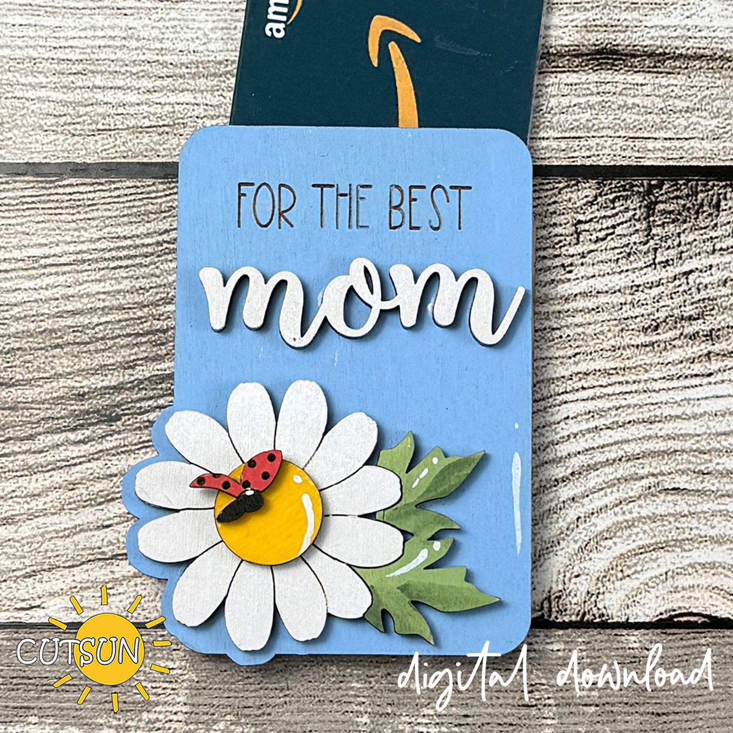 Blue daisy gift card holder with layered flower and ladybug detail, featuring “For the Best Mom” text, designed as a laser cut SVG with printable PNG files.
