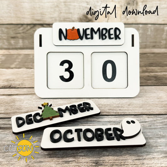 Laser-cut perpetual desktop calendar displaying November 30 with interchangeable October and December month pieces.